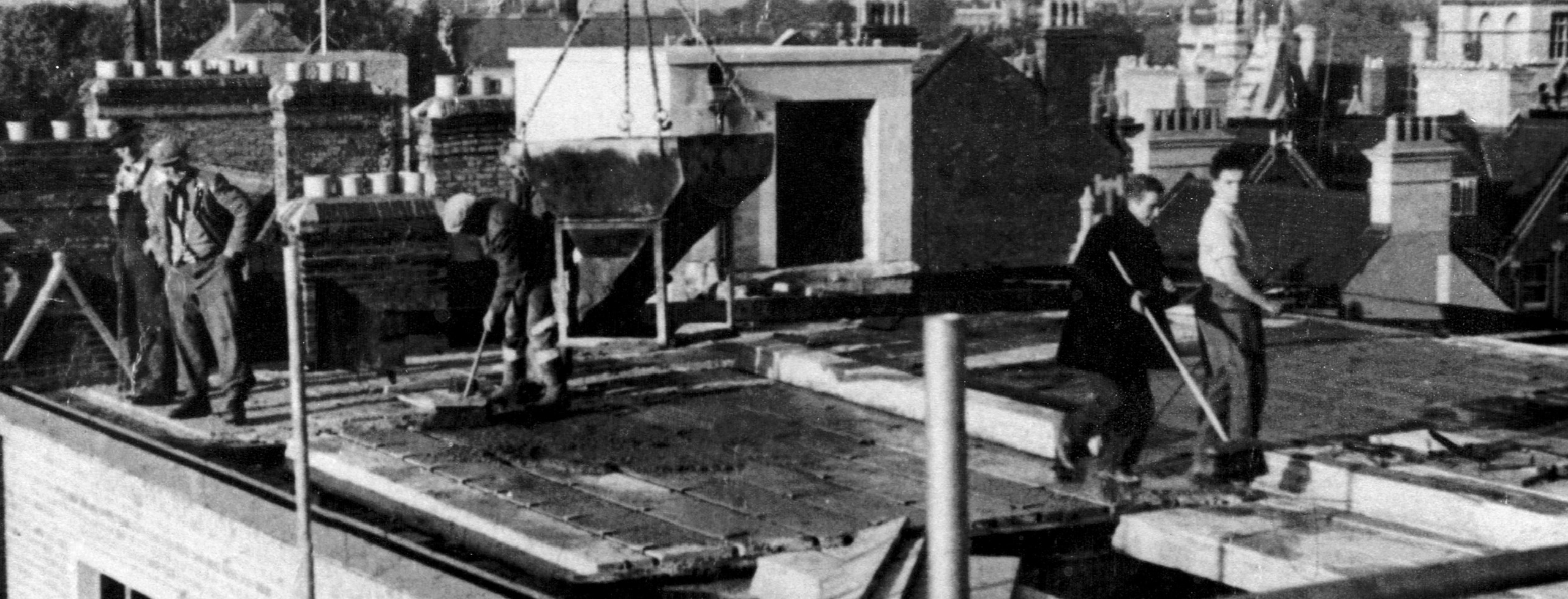 Builders on the roof of the original Clarendon Centre in Oxford