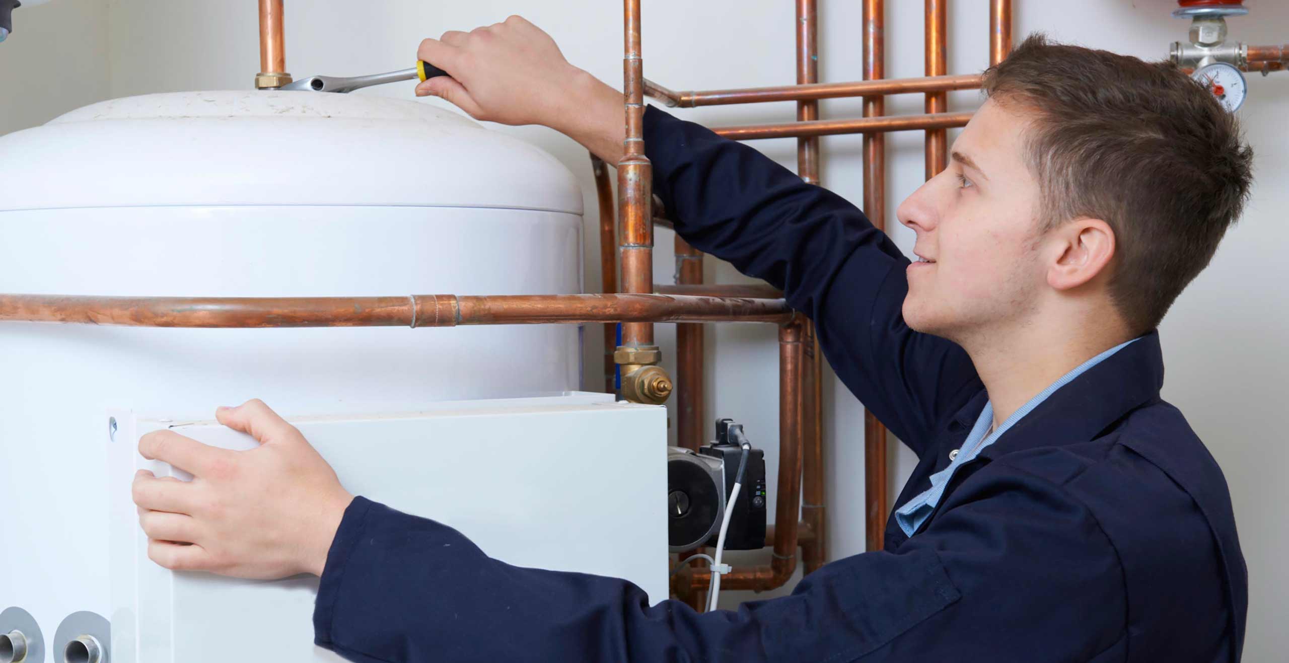 Plumber working on boiler